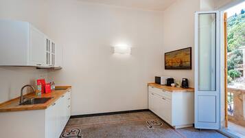 Apartment, Balcony | Private kitchen | Espresso maker, electric kettle