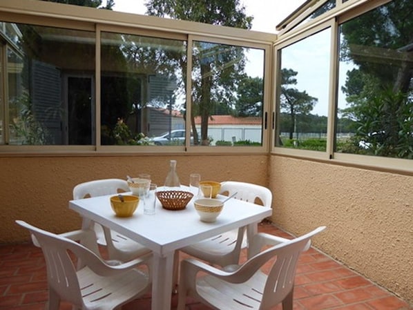 Enjoy a meal al fresco on the patio with a view of the surrounding landscape.