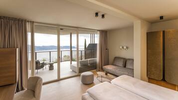 Junior Triple Room, Balcony, Lake View | Hypo-allergenic bedding available, minibar, in-room safe, desk