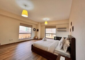 Apartamento família, vista para a praia | 3 quartos, quartos à prova de som, ferros/tábuas de passar roupa