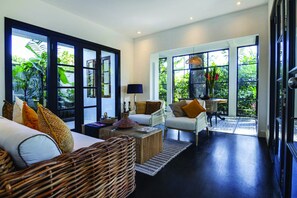 Suite, Pool View | Living area | TV