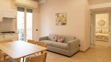 Deluxe Apartment, Balcony | Living area | 32-inch flat-screen TV with cable channels, Netflix, streaming services