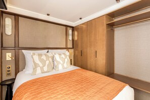 1 bedroom, desk, iron/ironing board, travel crib