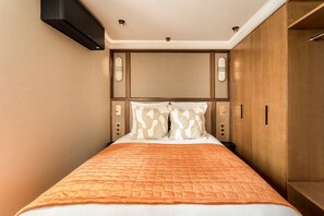 1 bedroom, desk, iron/ironing board, travel crib