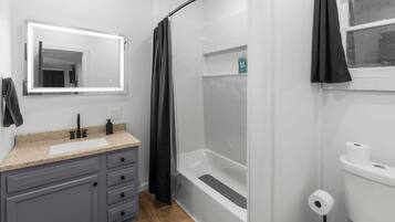 Hair dryer, towels, soap, toilet paper