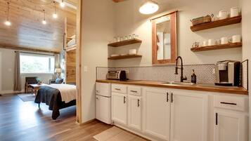 Fridge, coffee/tea maker, toaster, cookware/dishes/utensils