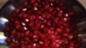 A bowl of red pomegranate seeds. - ANNAPURNA GUEST HOUSE (Nagpur)