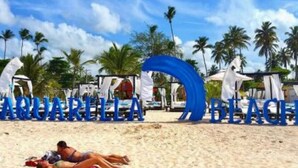 A beach with the text "AQUARILLA BEACH" in the background. - 2-Bedroom Luxury Villa in Lovely Puerto Plata with AC, WiFi sleeps 8! (Puerto Plata)