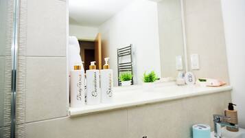 Shower, hair dryer, towels, soap
