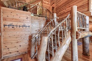A rustic wooden staircase with a natural finish and a metal handrail. - Waccabuck | 17.5 Private Acres, Pool, Hot Tub (Logan)