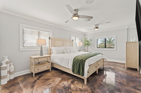 A bedroom with a bed, nightstands, a dresser, and a ceiling fan. - Luxurious "Villa Nella" (Naples)