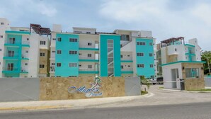 A modern building with a sign reading "Maple's Beach".