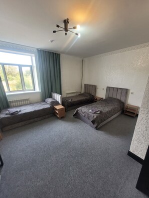 Luxury Triple Room, Non Smoking, Mountain View | Down comforters, desk, blackout drapes, soundproofing