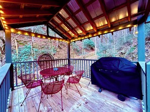 Outdoor dining - Cozy Riverfront Cabin with Creek Views, Hot Tub, Pool Table, and Fire Pit (Pigeon Forge)