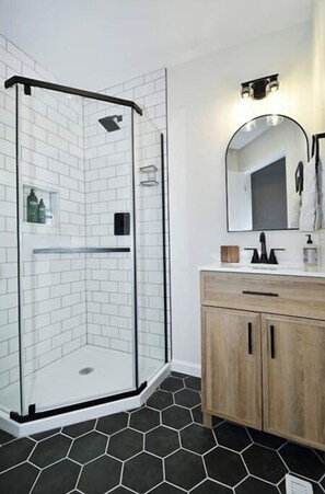 Shower, hair dryer, towels, soap