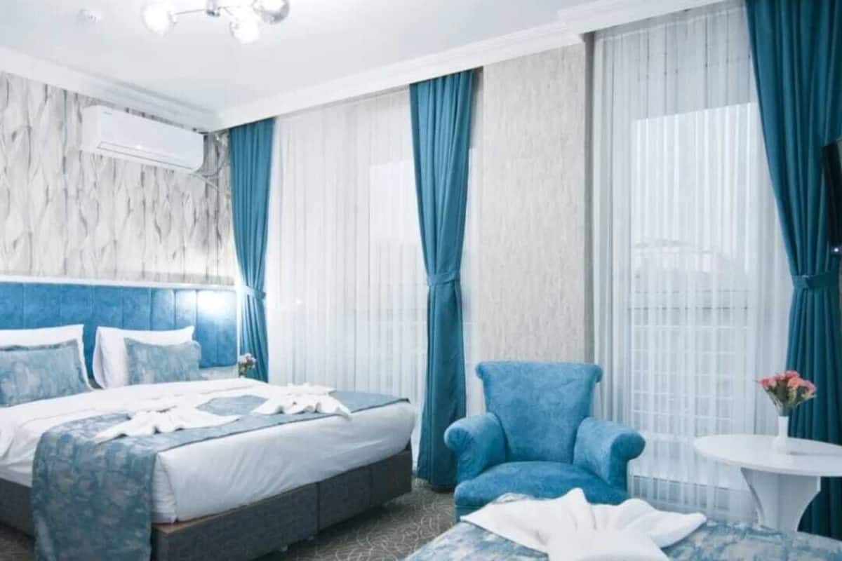 Classic Twin Room, Balcony, City View | In-room safe, desk, laptop workspace, iron/ironing board