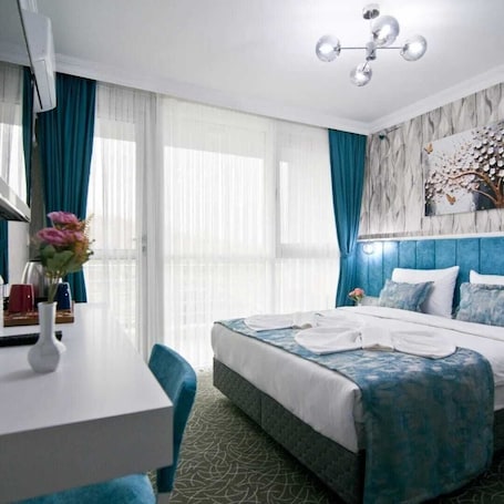 Classic Double Room, Balcony | In-room safe, desk, laptop workspace, iron/ironing board