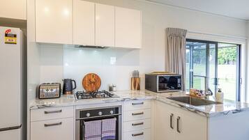 Fridge, microwave, cookware/dishes/utensils