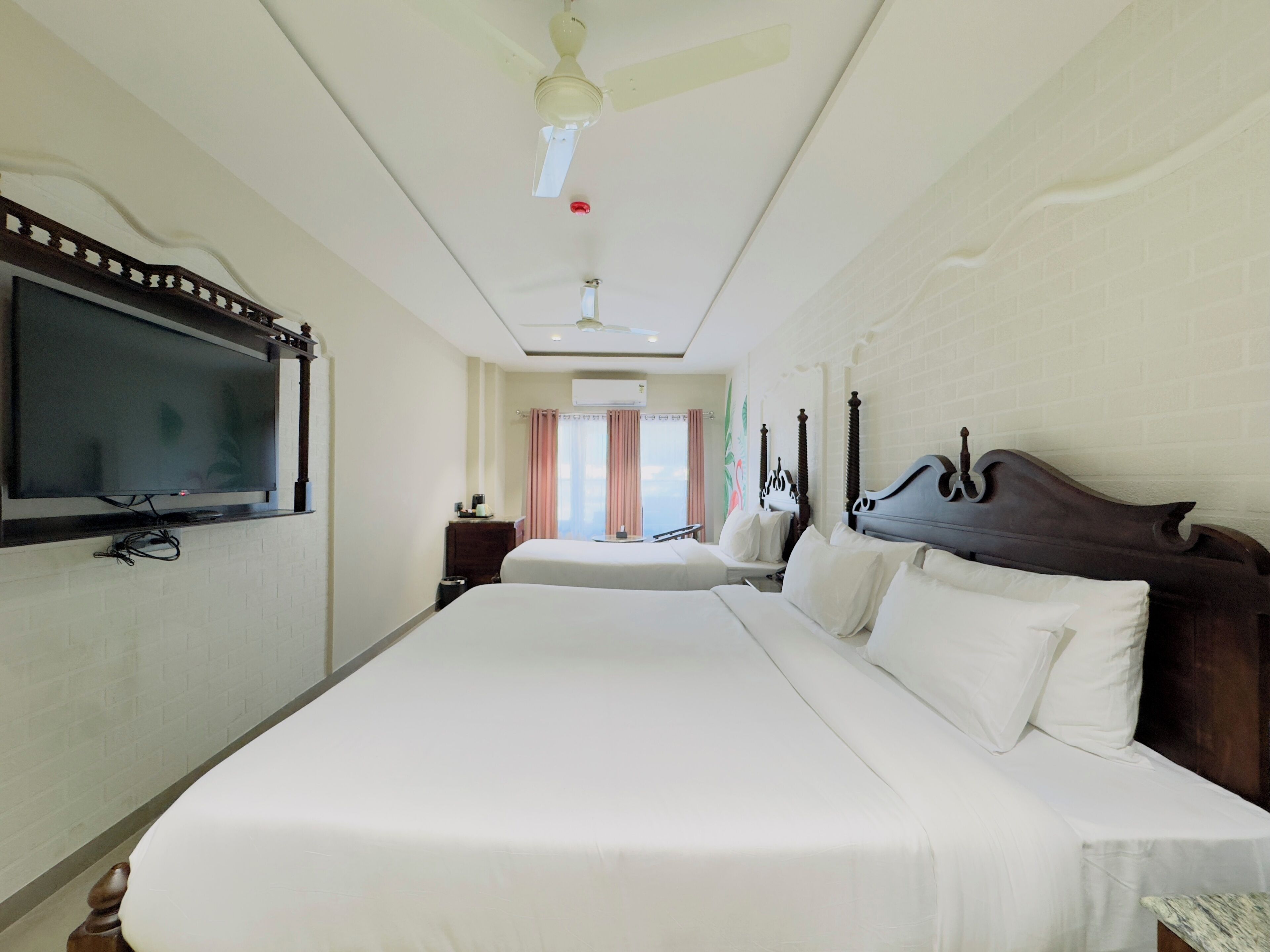 Premium bedding, memory foam beds, free minibar items, desk