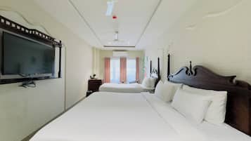 Premium bedding, memory-foam beds, free minibar items, desk