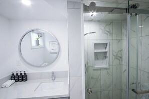 Shower, eco-friendly toiletries, hair dryer, towels