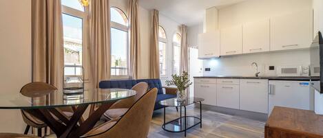 Family Apartment, City View | Living area | 35-inch Smart TV with satellite channels, Netflix, streaming services