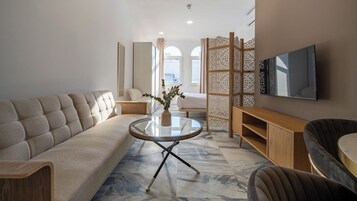 Studio, City View | Living area | 35-inch Smart TV with satellite channels, Netflix, streaming services