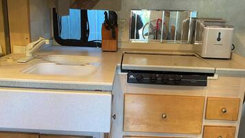 Fridge, microwave, stovetop, coffee/tea maker