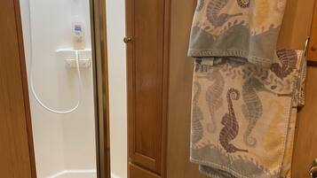 Shower, hair dryer, towels, soap