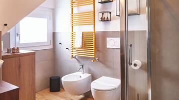 Shower, eco-friendly toiletries, hair dryer, bathrobes