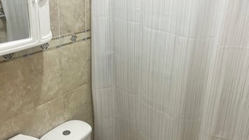 Shower, towels, soap, toilet paper