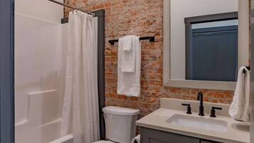 Hair dryer, towels, shampoo, toilet paper