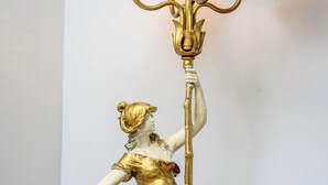 A tall, ornate chandelier with a golden statue of a woman holding a staff. - Fiddler On The Roof Room<br>Room with mountain views, a King-Size bed, en suite bathroom, and FREE breakfast. It sleeps 2. (Maplecrest)