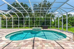 Outdoor pool, a heated pool - Port Boujee: Spacious 5-bedroom house in Port Charlotte with Pool, AC, WiFi (Port Charlotte)