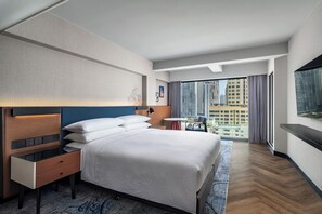 Suite estudio Deluxe, 1 cama King size, vista a la ciudad | Sábanas italianas Frette, ropa de cama de alta calidad y edredón 