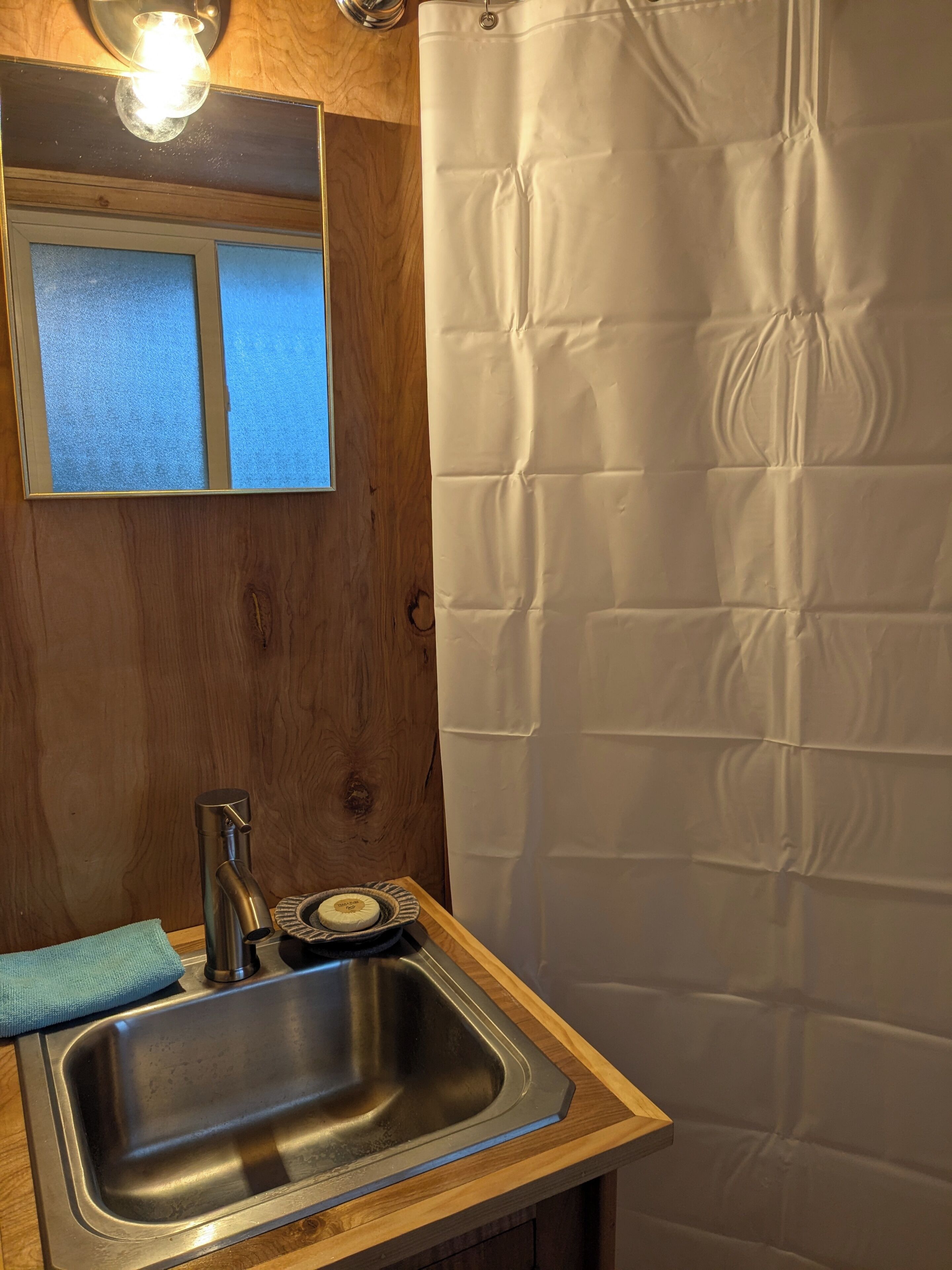 Shower, towels, soap, toilet paper