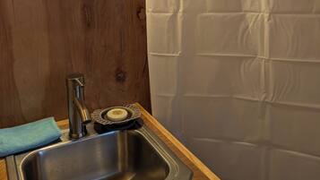 Shower, towels, soap, toilet paper