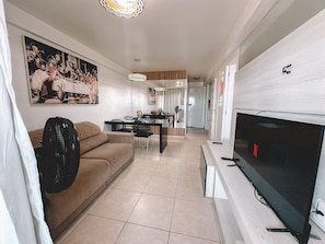 Comfort Apartment | Living area | 43-inch TV with digital channels
