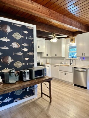 Microwave, stovetop, cookware/dishes/utensils, dining tables