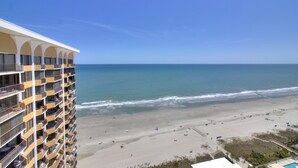 A high-rise hotel with multiple balconies overlooking a beach. - Stunning 2BR/2BA Oceanfront Penthouse at Maisons-Sur-Mer in Myrtle Beach (Myrtle Beach)