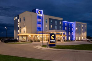 A Comfort Inn & Suites hotel with a modern design, featuring a prominent signage and a well-lit entrance. - Comfort Inn & Suites Colby (Colby)