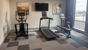 A fitness room with cardio equipment, a treadmill, and a stationary bike. - Comfort Inn & Suites Colby (Colby)
