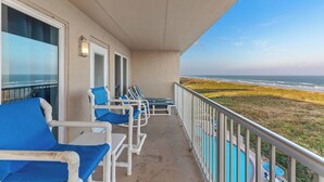 A balcony with blue chairs and a view of the ocean. - Experience Beachfront Luxury w/ Spectacular Views! Pool & Hot Tub (South Padre Island)