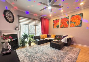 Smart TV, fireplace, table football, books