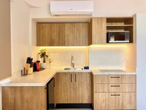 Microwave, stovetop, coffee/tea maker, toaster