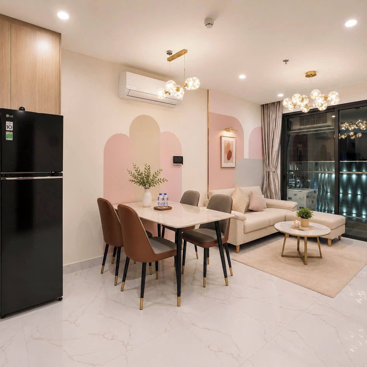 A modern living room with a dining area, a black refrigerator, and a large window with curtains.