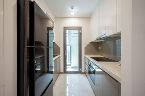 Standard Apartment, Balcony, City View | Private kitchen | Rice cooker, paper towels - Lyshing Apartment in Vinhomes Grand Park (Ho Chi Minh City)