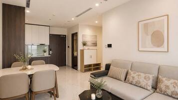 Standard Apartment, Balcony, City View | Living area | Flat-screen TV