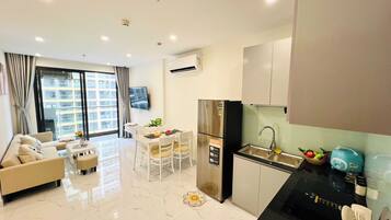 Family Apartment, Balcony, City View | Living area | Flat-screen TV