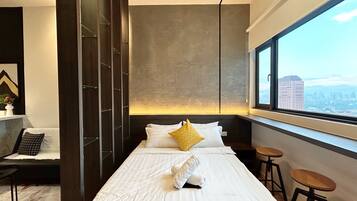 Estudio | Tabla de planchar con plancha, wifi gratis, ropa de cama